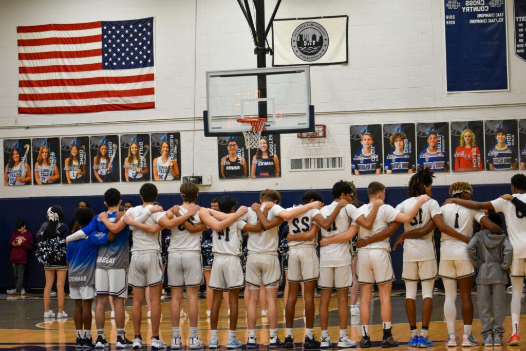 cheerleaders huddled up in gym